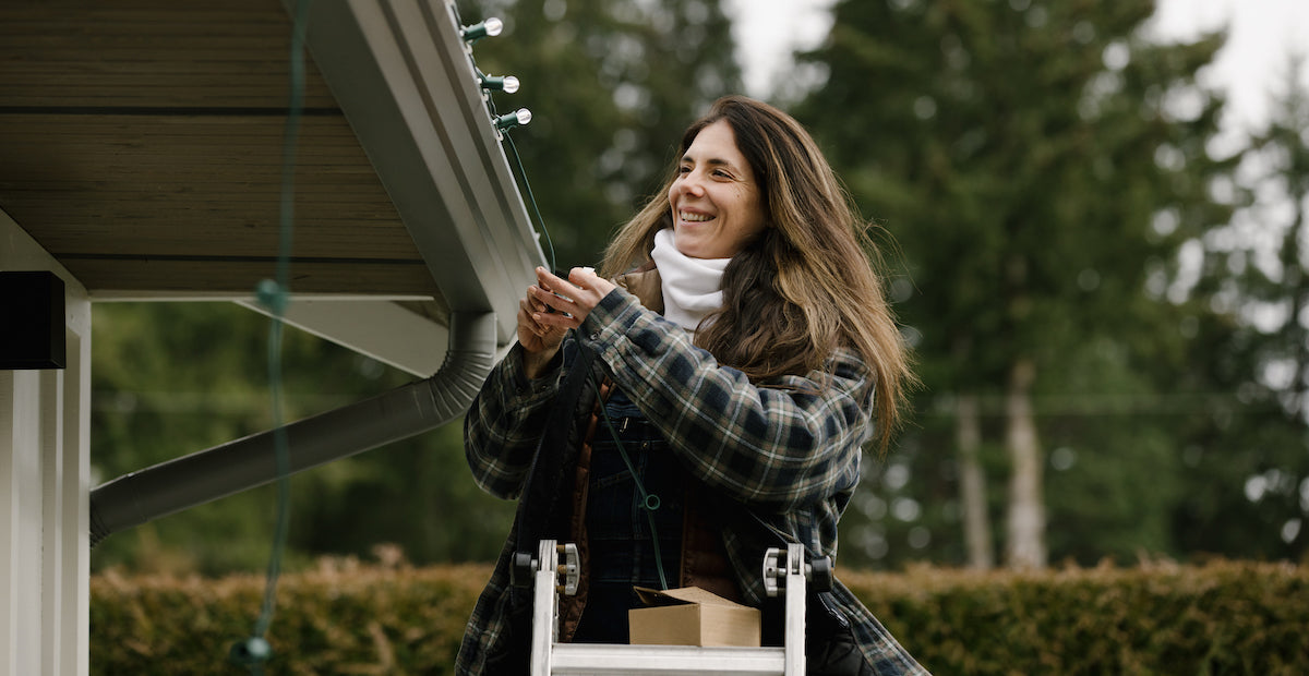 Woman hanging G30 Warm White Christmas Lights