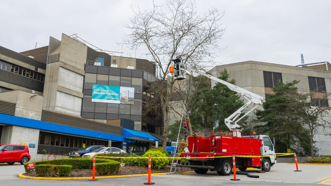 Bucket Truck in front of apartment building